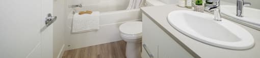 a bathroom with a sink toilet and a shower