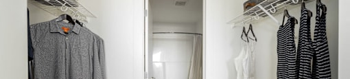 a walk in closet with a door to the bathroom