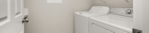 A laundry room with a washer and dryer.