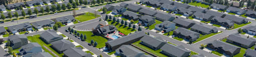 A bird's eye view of a residential neighborhood with houses and streets.