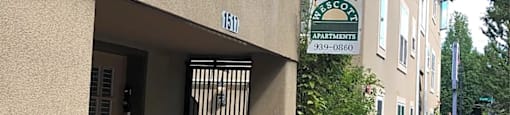 the front of a building with a gated door entrance