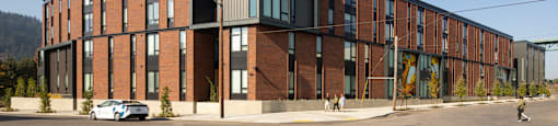 a large red brick building on a city street