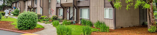 our apartments are located in a quiet neighborhood with trees and grass