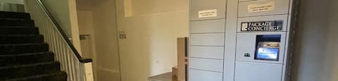 a building with a refrigerator and stairs in it