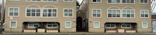 a couple of buildings on the side of a street