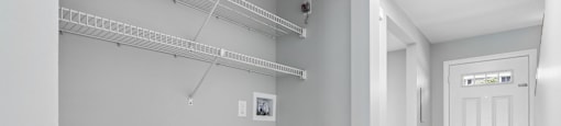 A white door is on the right side of the room.