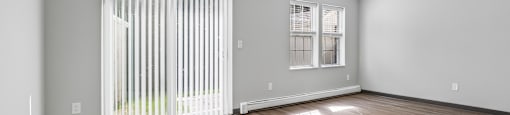 A room with a sliding door and a window.