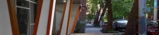 Building with bushes and a sidewalk at Astro, Seattle, WA, Washington
