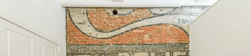 an old sign on a brick wall reads 5¢ relief sold