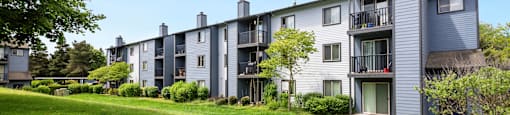 exterior view of apartment buildings on a sunny day at Eagles Landing Apartments, Everett, 98204