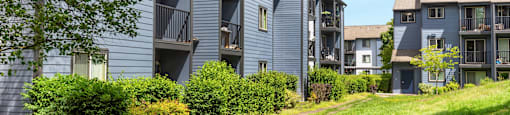 a path leading up to a row of apartment buildings at Eagles Landing Apartments, Everett, 98204