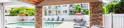 pool and patio with furniture and a grill  at Sage Apartments, Everett, WA, 98204