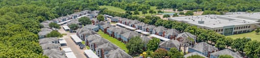 an aerial view of a neighborhood with houses and trees at Villas of Sorrento Apartments, Dallas, TX