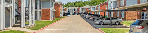 a row of town homes with cars parked on the street at Villas of Sorrento Apartments, Dallas, TX, 75241