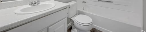 a bathroom with a sink toilet and a shower at Villas of Sorrento Apartments, Dallas, TX, 75241