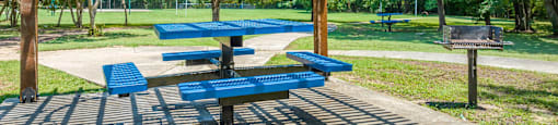 a picnic area with benches and a pavilion at Villas of Sorrento Apartments, Dallas, TX, 75241