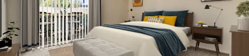 a bedroom with a bed and a sliding glass door at Azul Apartments, Hemet, CA, 92545