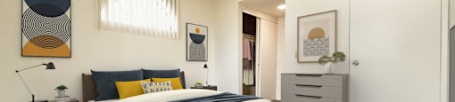 a bedroom with a bed and a white closet