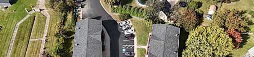 A parking lot is in front of a building.