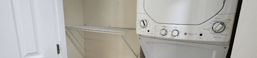 A white washer and dryer in a small laundry room.