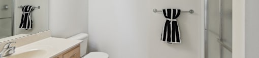a bathroom with a sink toilet and a walk in shower