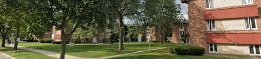 Brick building exterior with grassy areas and walkways at The Countryside, Countryside Illinois ?