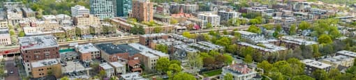 an aerial view of a city with buildings and trees at The Bryant at Oak Park I & II, Illinois