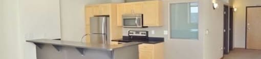 Modern Kitchen with appliances and cabinets at Boston Lofts, Wisconsin