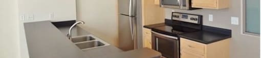 Kitchen with appliances and cabinetsat Boston Lofts, Milwaukee