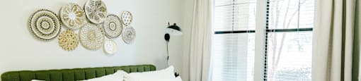 Tapestry at Hollingsworth Park bedroom with a large white bed with white sheets and pillows