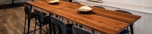 a kitchen and dining room with a wooden table