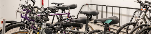 a bunch of bikes parked in a rack