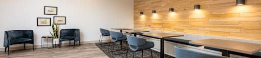 A conference room with a long table and chairs.