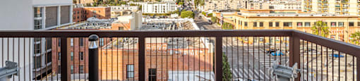 A balcony with a white fire hydrant on it.