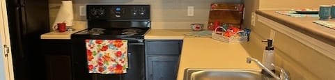 a small kitchen with a sink and a stove