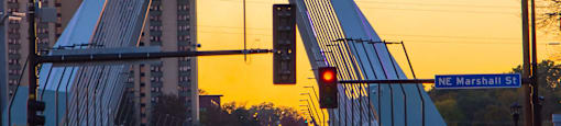 the traffic on a bridge at sunset