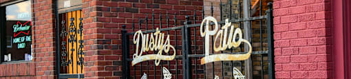 a brick building with a sign on the side of it