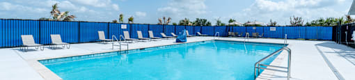 An outside pool with the sky in the background.
