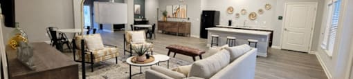 a large living room with a couch and a table at Agave East apartments