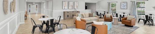 A white room with a table and chairs.