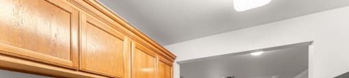A kitchen with wooden cabinets and a granite countertop.