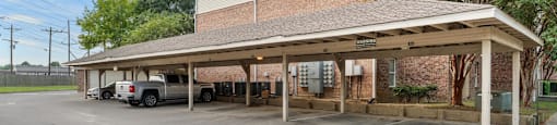 A parking lot with a building in the background.