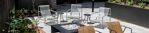 a group of chairs and tables around a fire pit on a patio at Analog PDX, Oregon