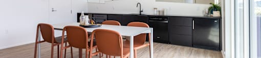 a dining room and kitchen with a table and chairs at Analog PDX, Oregon