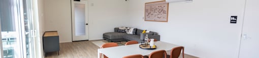 a living room and dining room with a table and chairs at Analog PDX, Oregon