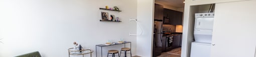 a bedroom and living room with a bed and a kitchen at Analog PDX Apartments, Oregon