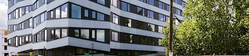 an office building on a city street with a blue sky at Analog PDX, Oregon