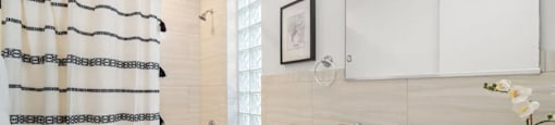 a bathroom with a shower and a sink and a toilet