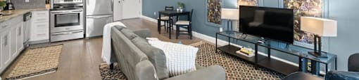 a living room with a couch and a tv