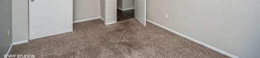 Bedroom with plush carpeting